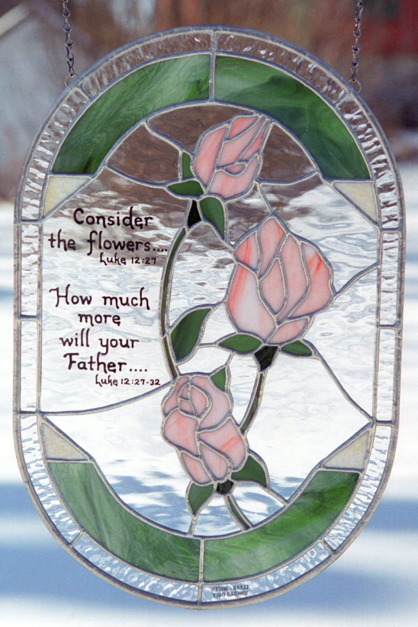 Stained glass panel with roses and bible verse
