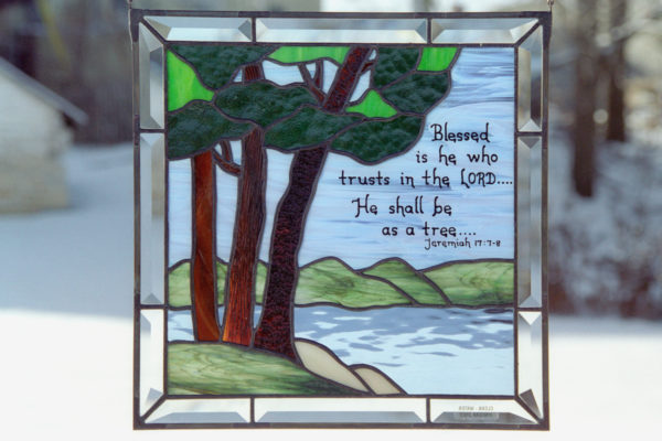 Stained glass with trees and bible scripture